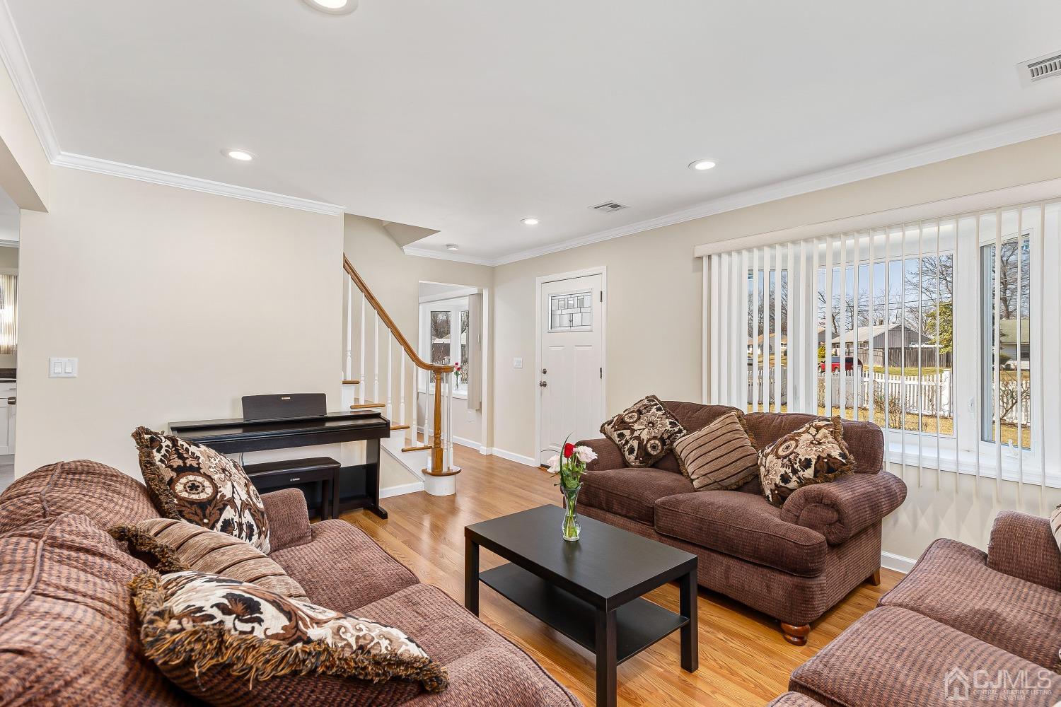 39 Miko Road Edison, NJ 08817 - Photo 6 of 22 a living room with furniture and a piano