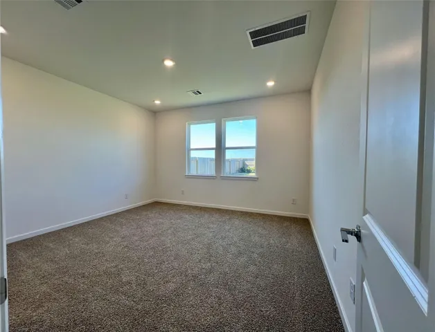 en empty room with windows