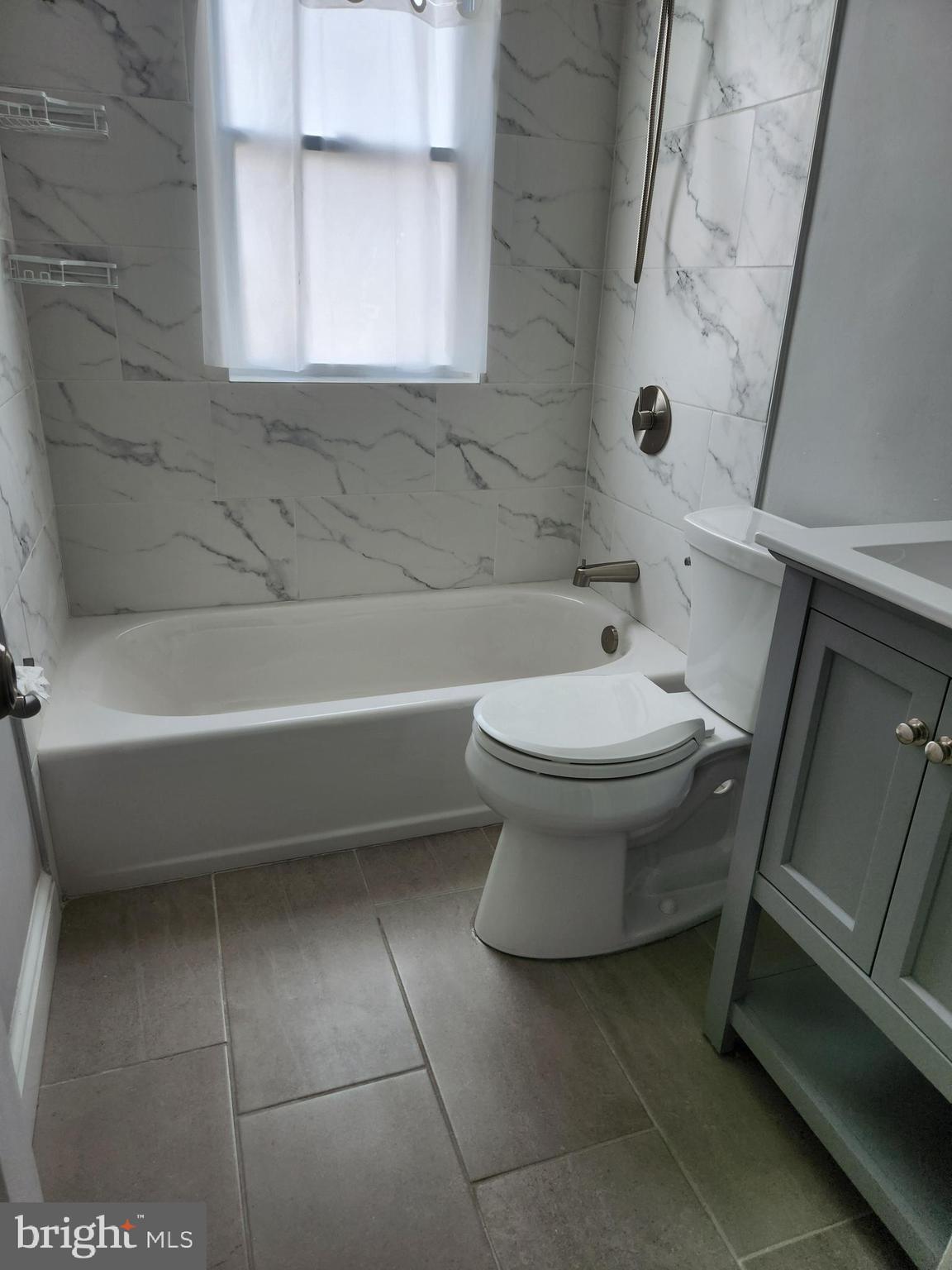 1702 Lang Place Northeast Washington, DC 20002 - Photo 15 of 36 a bathroom with a toilet and a bathtub