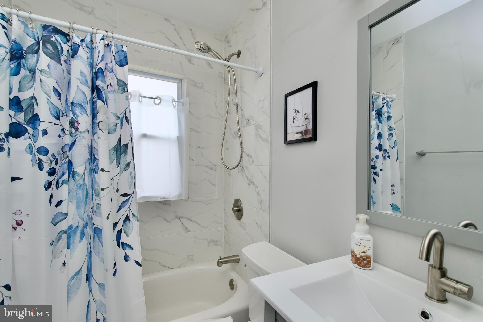 1702 Lang Place Northeast Washington, DC 20002 - Photo 16 of 36 a bathroom with a sink and a bathtub