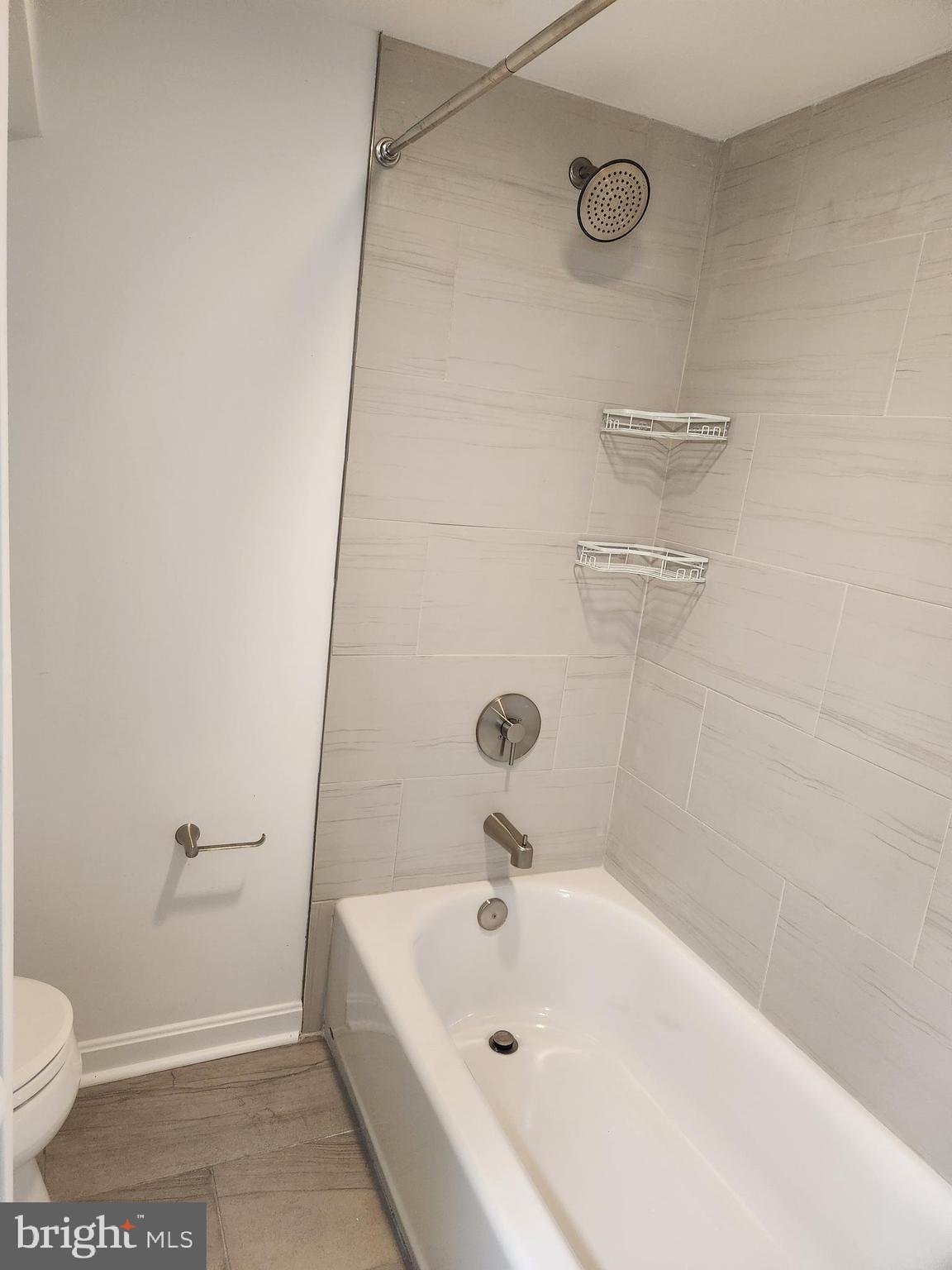 1702 Lang Place Northeast Washington, DC 20002 - Photo 26 of 36 a bathroom with a sink a toilet and shower