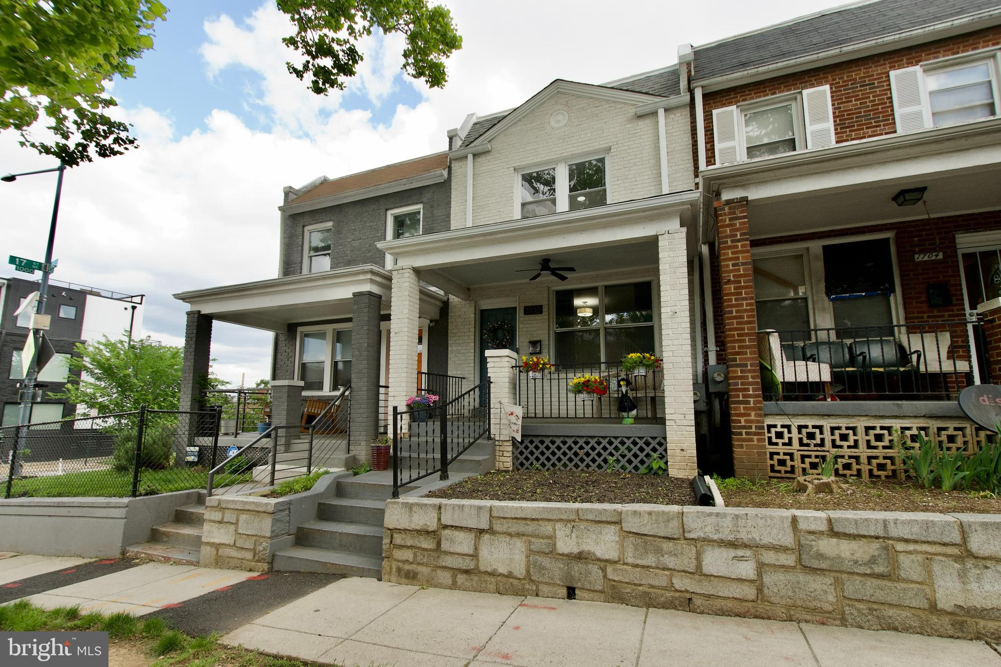 1702 Lang Place Northeast Washington, DC 20002 - Photo 36 of 36 a view of a brick building with large windows