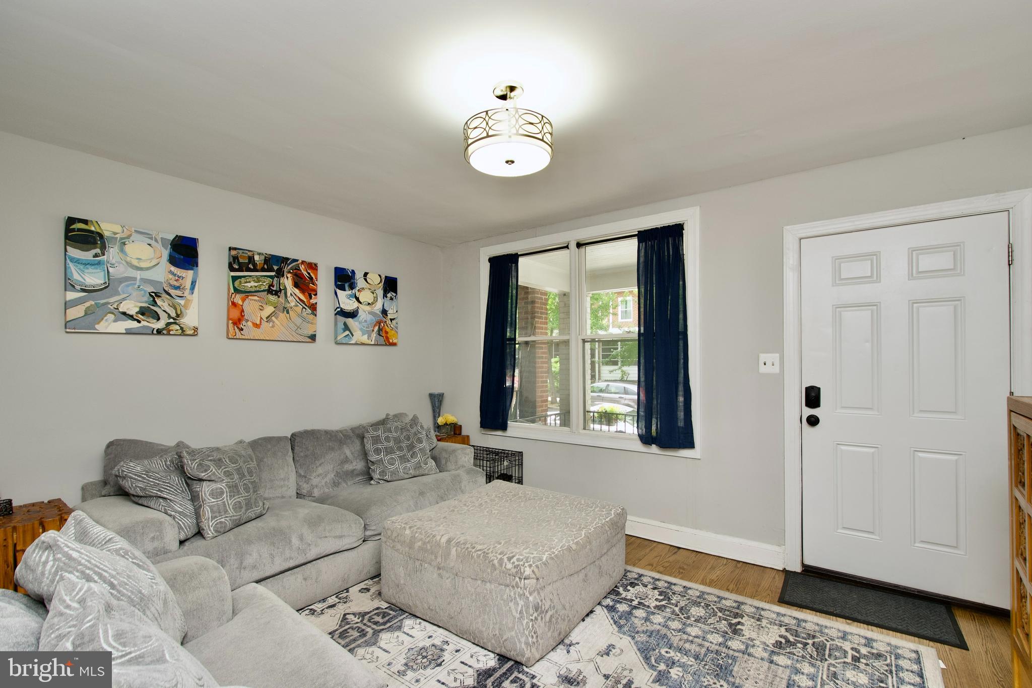 1702 Lang Place Northeast Washington, DC 20002 - Photo 5 of 36 a living room with furniture and a window