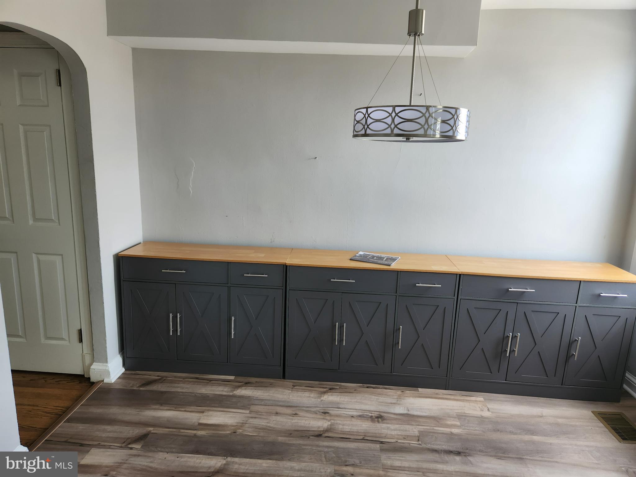 1702 Lang Place Northeast Washington, DC 20002 - Photo 8 of 36 a view of a hallway with wooden floor