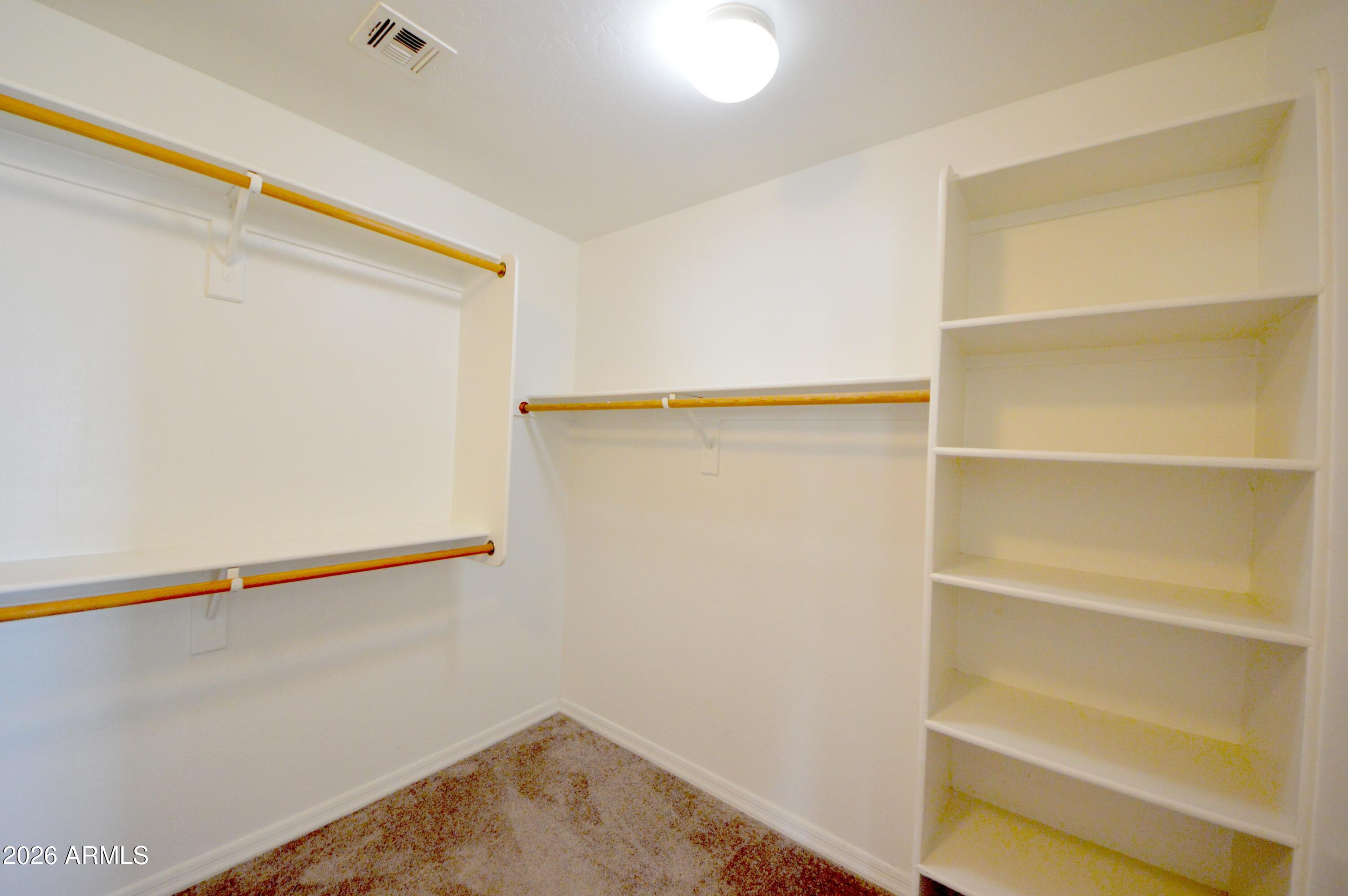 5115 West Novak Way Laveen, AZ 85339 - Photo 31 of 52 Primary Bedroom Huge Closet with Cabinet
