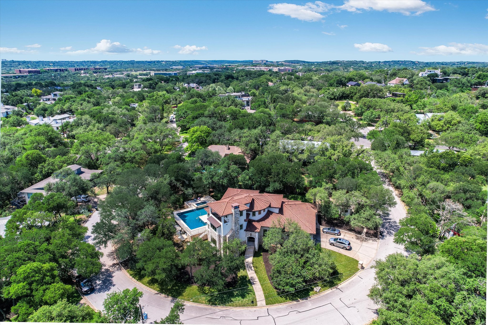11 Inwood Circle Austin, TX 78746 - Photo 37 of 38 Discover a private oasis nestled amongst lush greenery, featuring a captivating pool and mature landscaping.