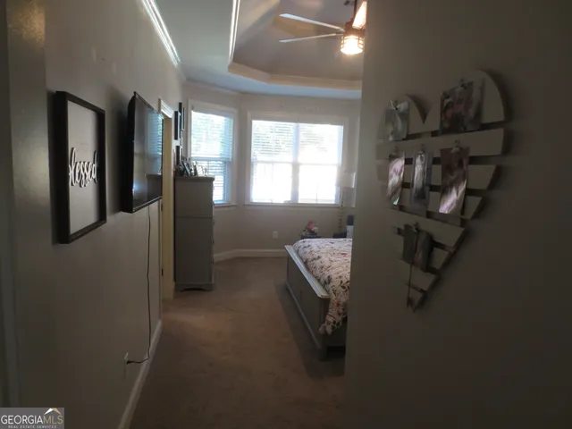 a bedroom with a bed and a dresser in it