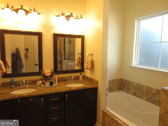 a bathroom with a shower and a tub