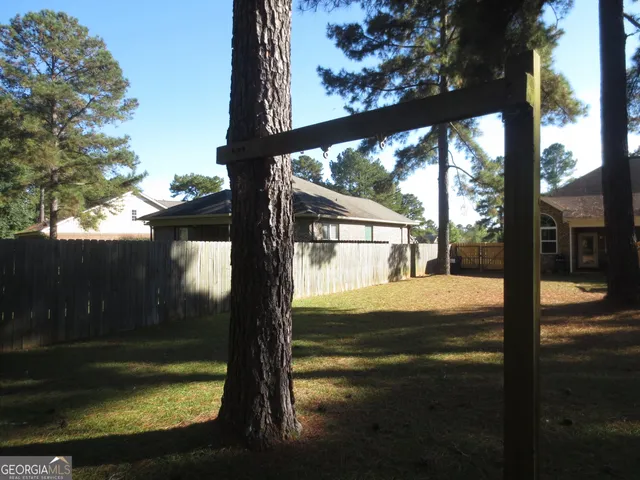 a swimming pool view with a outdoor seating