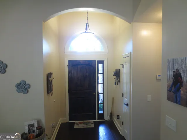 walk in closet with wooden floor