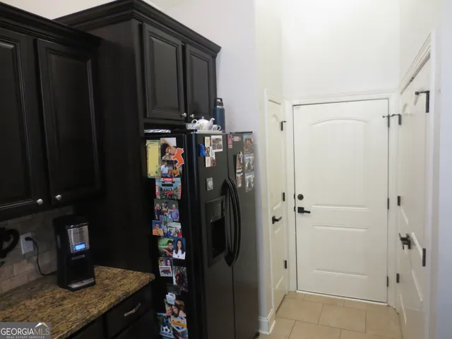 a view of a refrigerator and storage