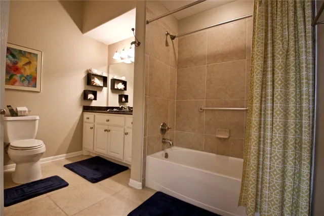 a bathroom with a toilet a sink and bathtub