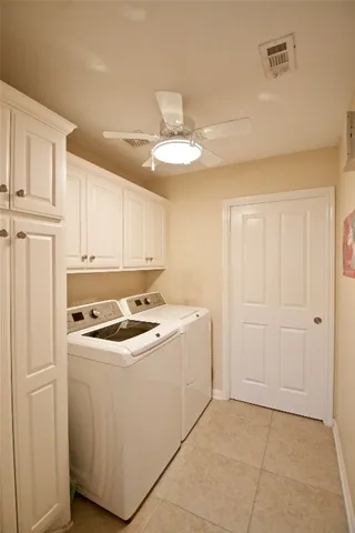a kitchen with a stove a sink and cabinets