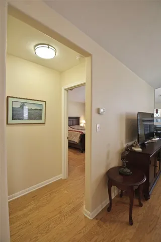 a workspace with furniture and a bathroom