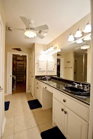 a kitchen with a refrigerator and a sink