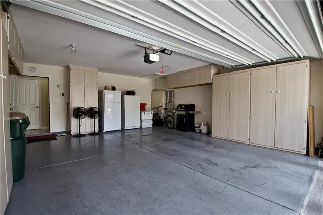 a view of a livingroom with furniture and a ceiling fan