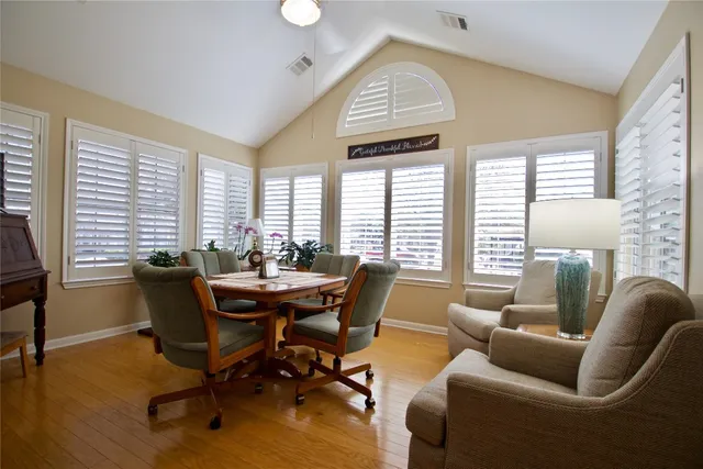 a dining room with furniture and windows
