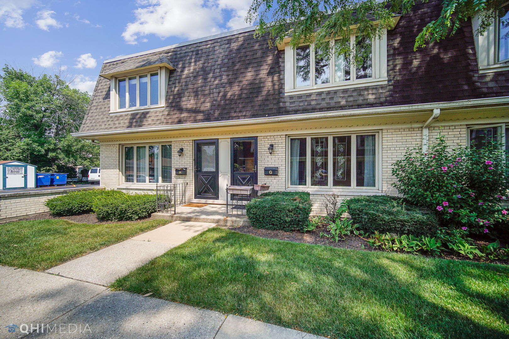 2128 West 111th Street, Unit G Chicago, IL 60643 - Photo 1 of 20 front view of a brick house with a yard