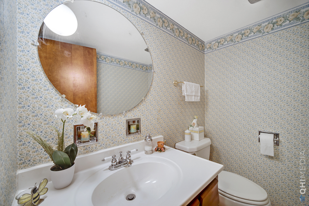 2128 West 111th Street, Unit G Chicago, IL 60643 - Photo 11 of 20 a bathroom with a sink a mirror and toilet