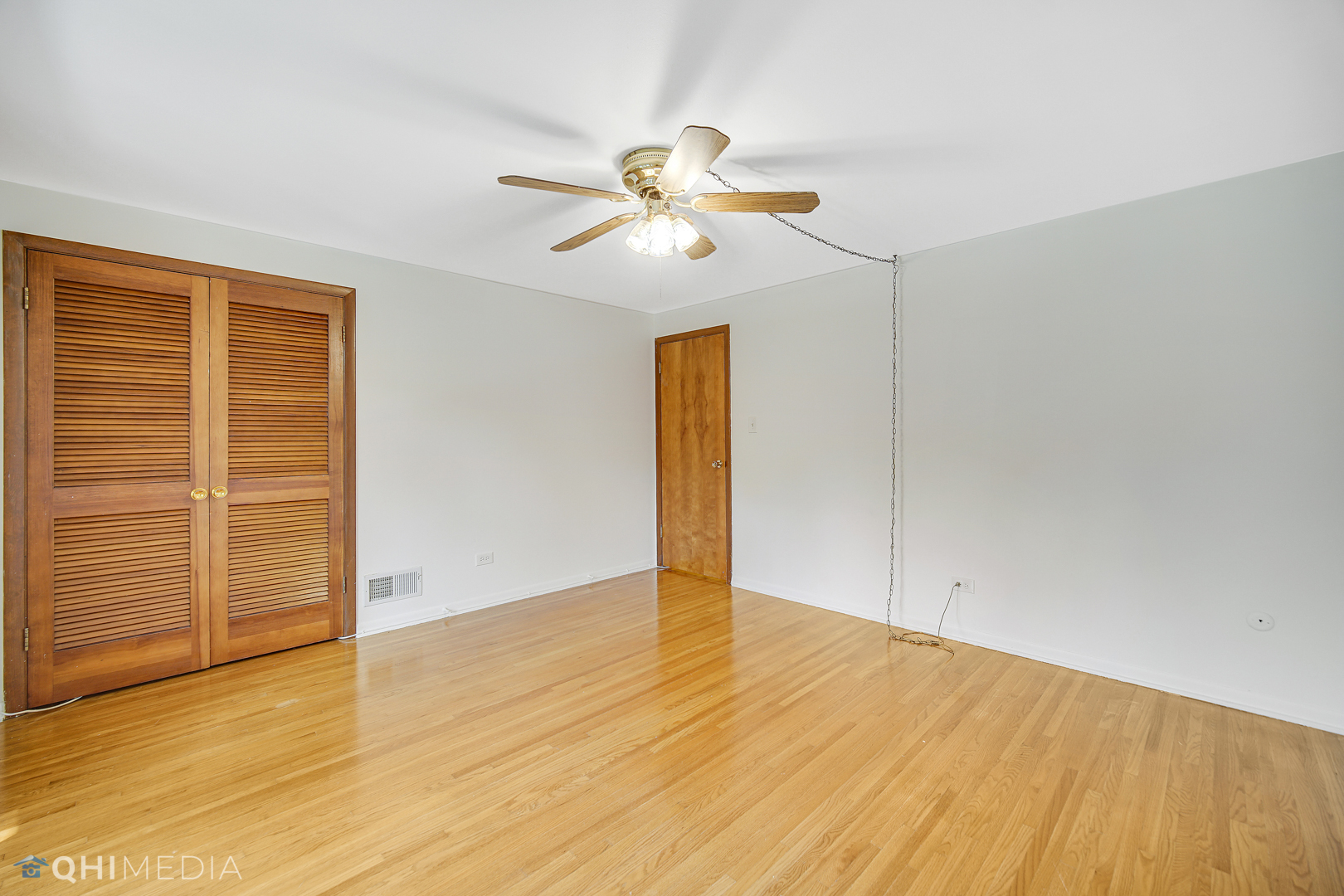 2128 West 111th Street, Unit G Chicago, IL 60643 - Photo 17 of 20 a view of empty room with wooden floor