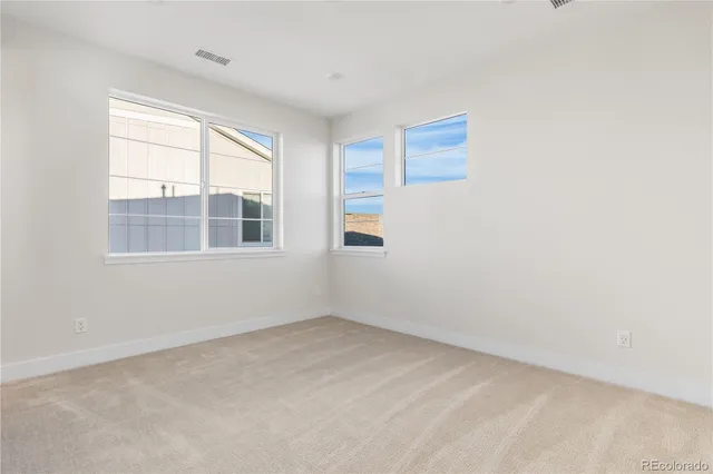 a view of empty room with windows