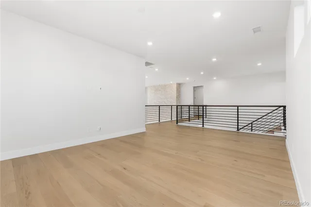 a bathroom with a sink and mirror with toilet