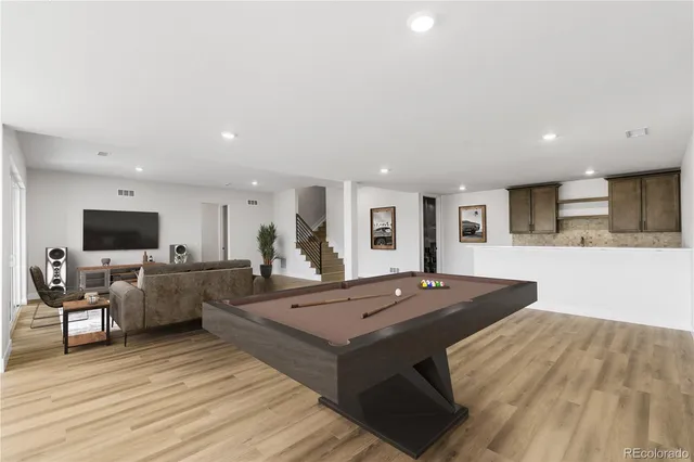 a living room with furniture and flat screen tv