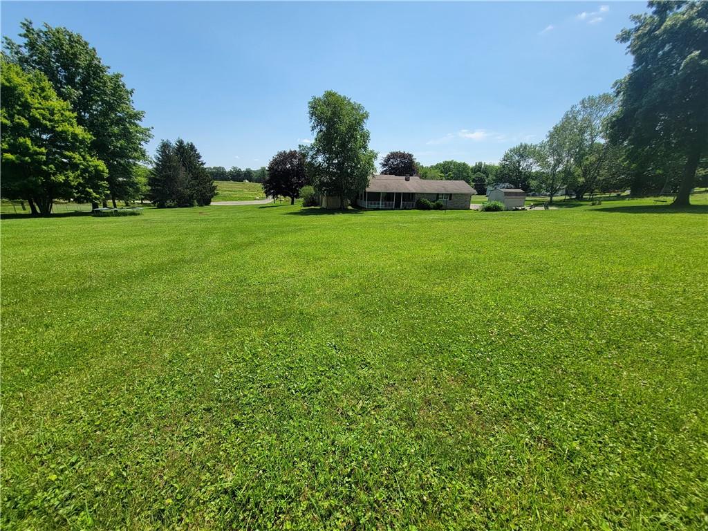 130 Pflugh Road Butler, PA 16001 - Photo 22 of 25 a view of a garden with a house in the background