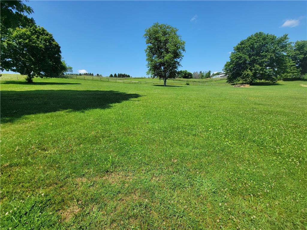 130 Pflugh Road Butler, PA 16001 - Photo 23 of 25 a view of a grassy field with trees