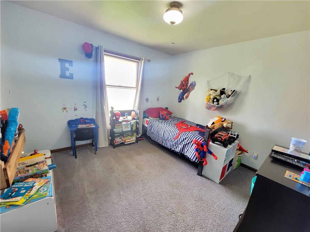 130 Pflugh Road Butler, PA 16001 - Photo 9 of 25 a bedroom with a bed and a window