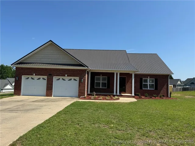a view of a house with outdoor space and porch