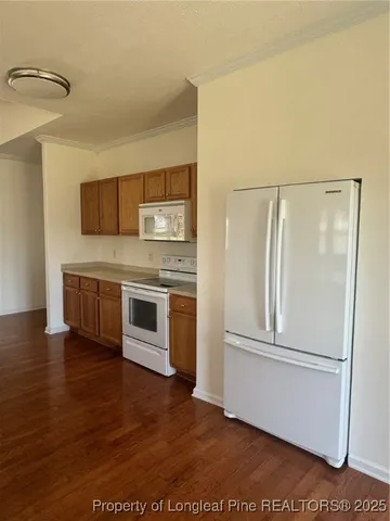 a kitchen with stainless steel appliances a refrigerator and a microwave