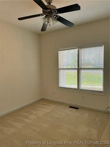 a bathroom with a sink toilet vanity and mirror