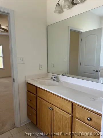 a white toilet sitting next to a white wall