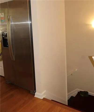 an empty room with wooden floor