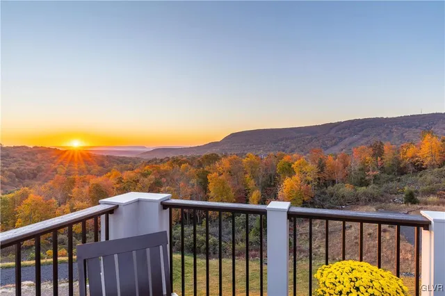 a view of city and mountain from a balcony
