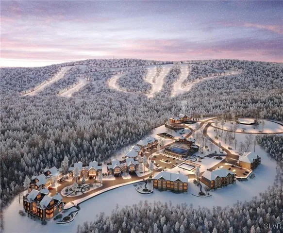 an aerial view of a house with a yard basket ball court and outdoor seating