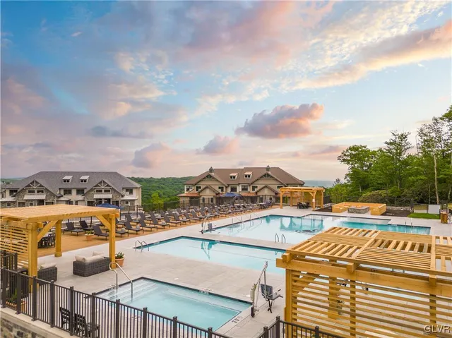 a view of a swimming pool with a lounge chairs