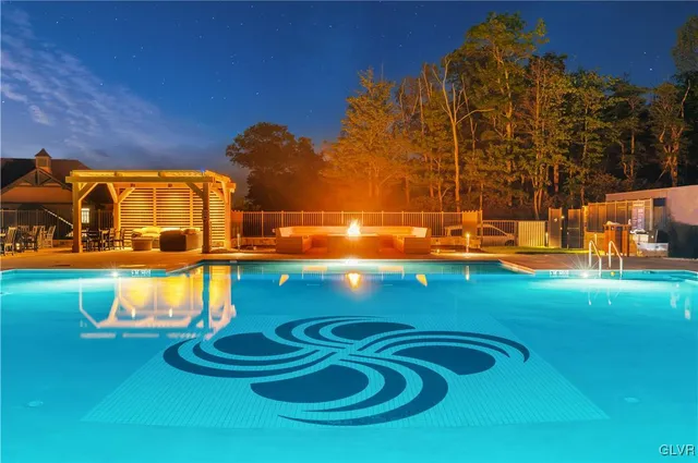 a view of swimming pool with outdoor seating