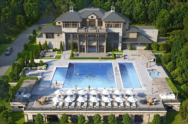 front view of a house with a swimming pool