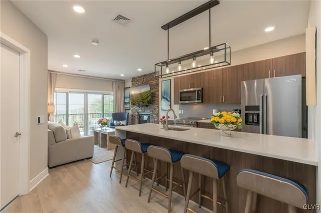 a kitchen with counter space dining table and chairs