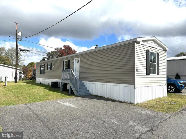 a view of a house with a yard and garage
