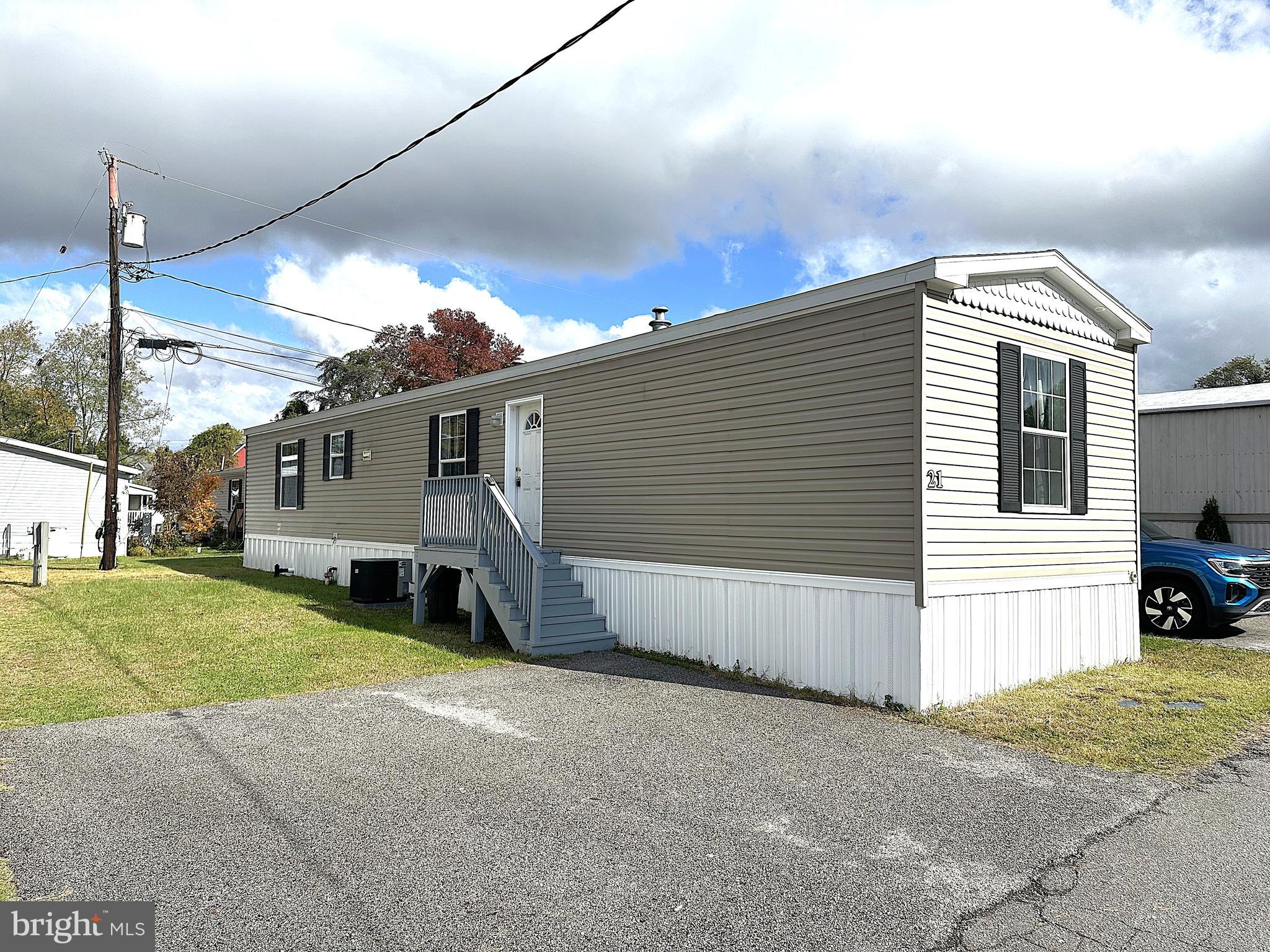 490 North Patuxent Road, Unit 21 Odenton, MD 21113 - Photo 1 of 22 a view of a house with a yard and garage