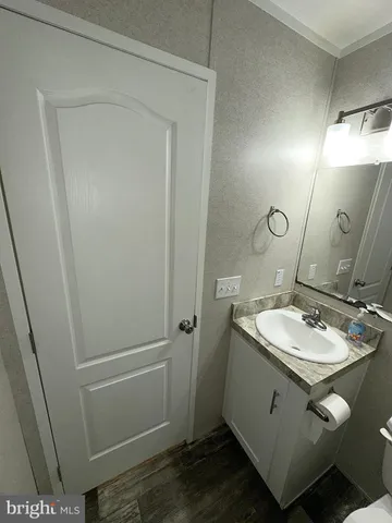 a bathroom with a sink and mirror