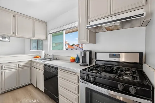 a kitchen with a stove and a sink