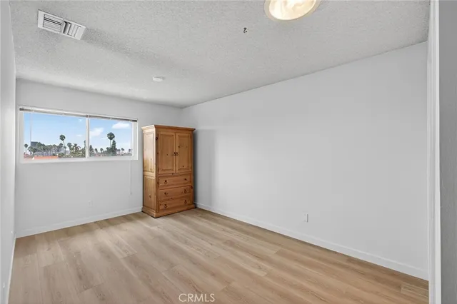 a view of a kitchen with wooden floor