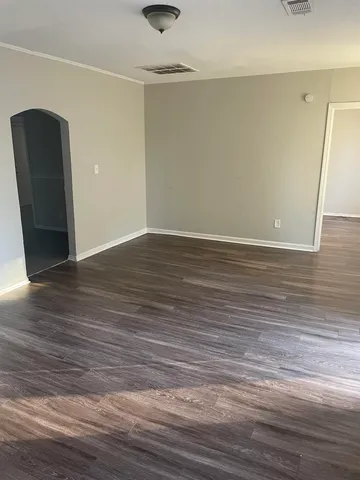 a view of a livingroom with wooden floor