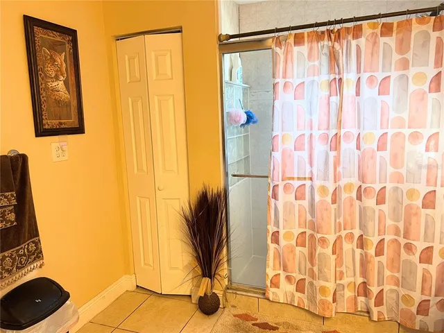 a view of a bathroom with a shower curtain