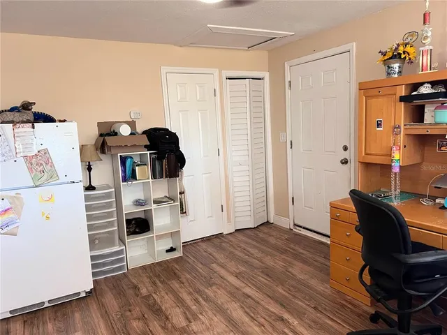 a view of kitchen with furniture and wooden floor