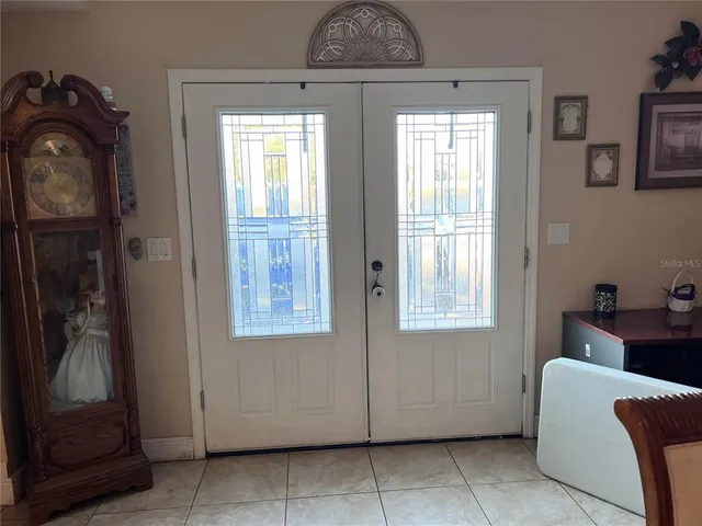 a view of a livingroom with furniture and entryway